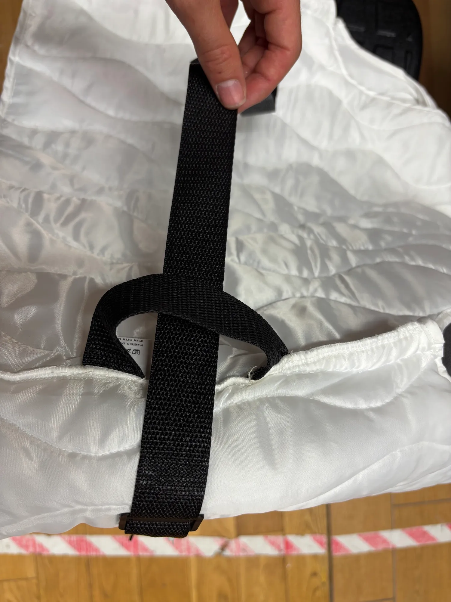 The belt, sewn into a jacket.
