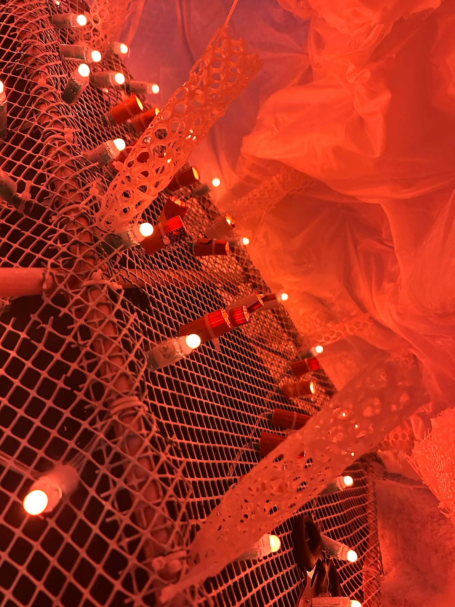 The LEDs and struts inside the pyramid, lit orange.