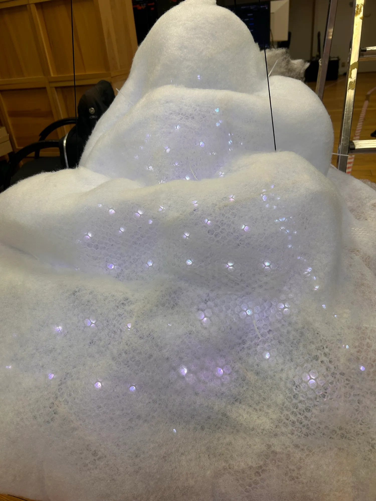 The wadding-covered cloud lit white, with the LEDs still showing through as points.