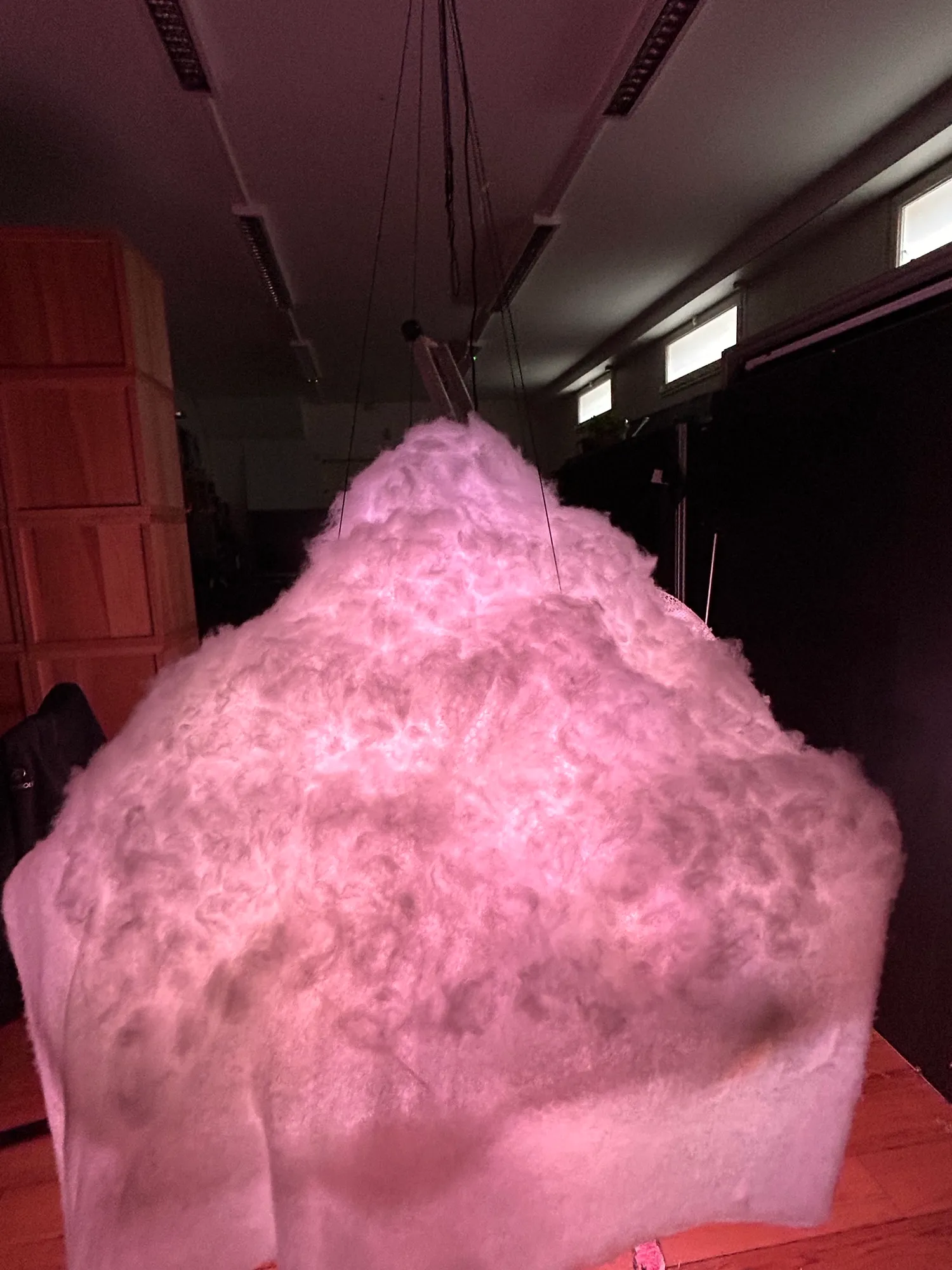 Tufts of cotton pulled over the wadding, glowing pink.