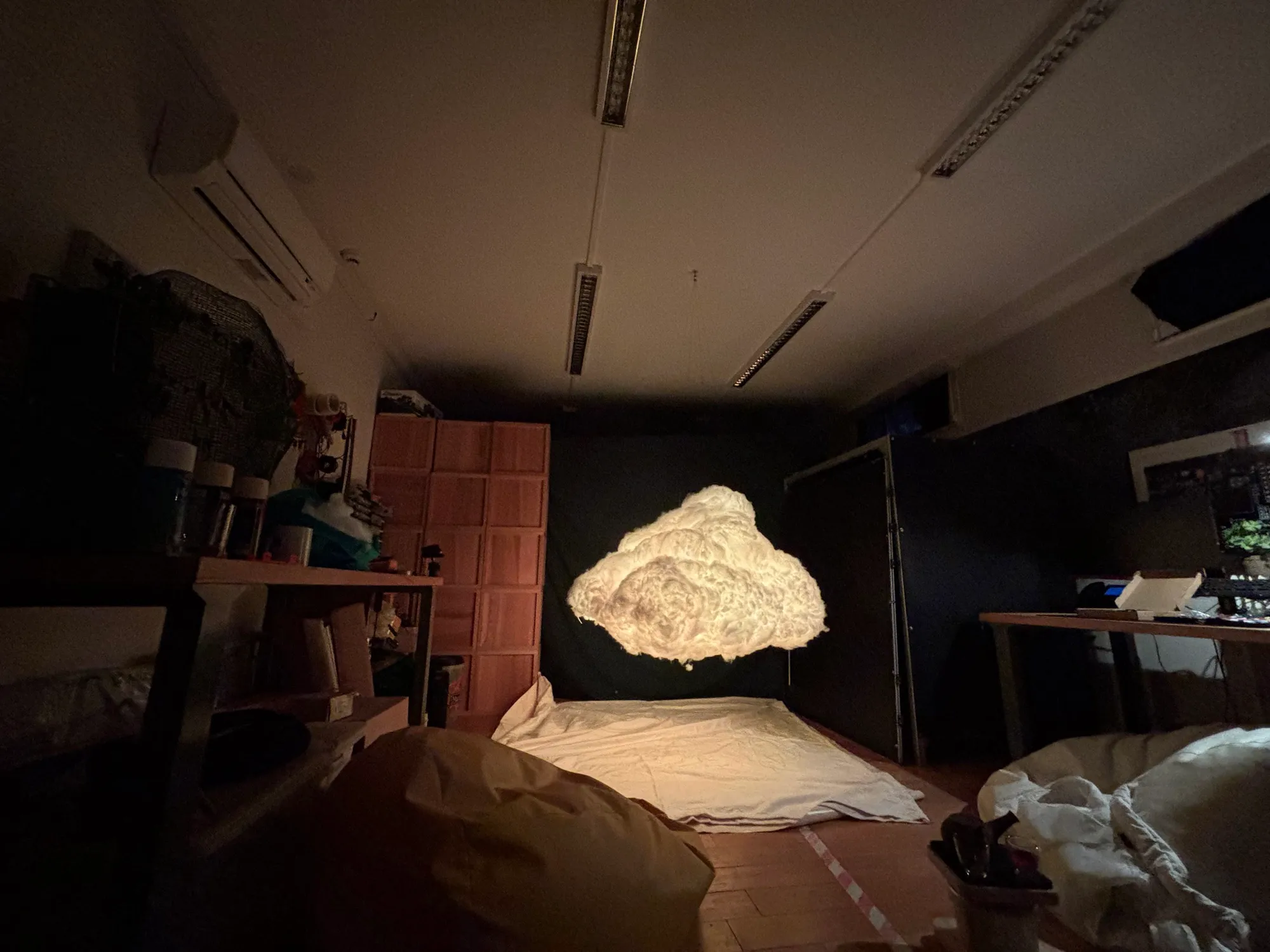 A fisheye view of the workshop with the cloud glowing white in its corner.