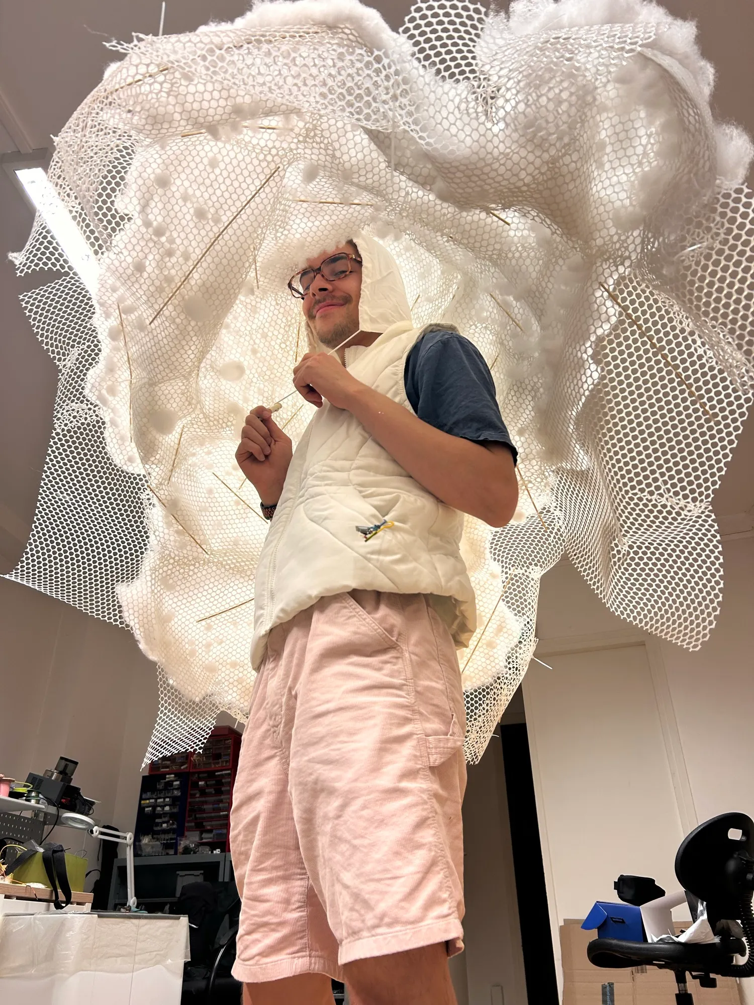 Zéphir under the cotton-stuffed mesh shell, pulling the strings of his hood.